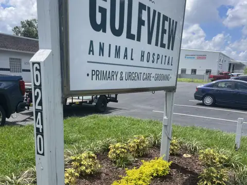 Commercial sign post and landscaped bed after rust removal