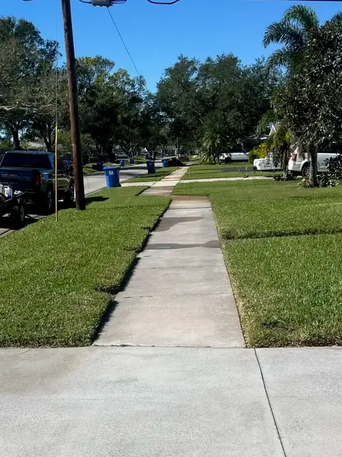 The same front sidewalk after rust removal