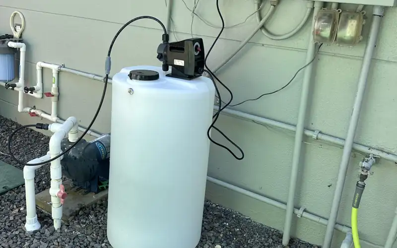 Rust prevention solution tank and injection pump plumbed into an irrigation system