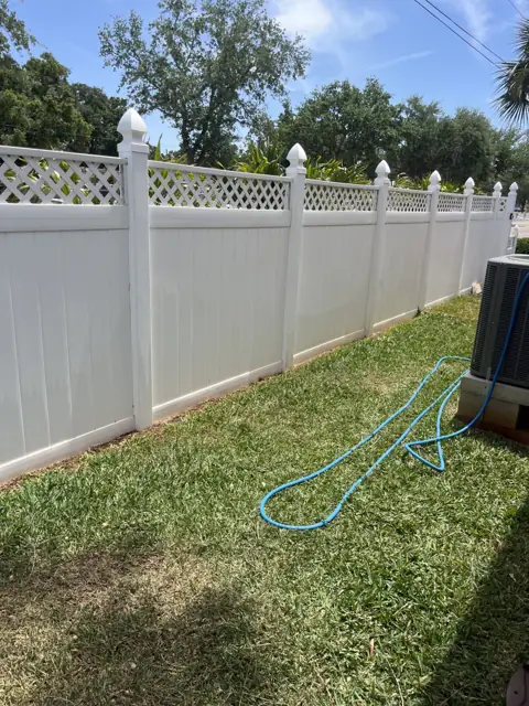 The same lattice fence after rust removal