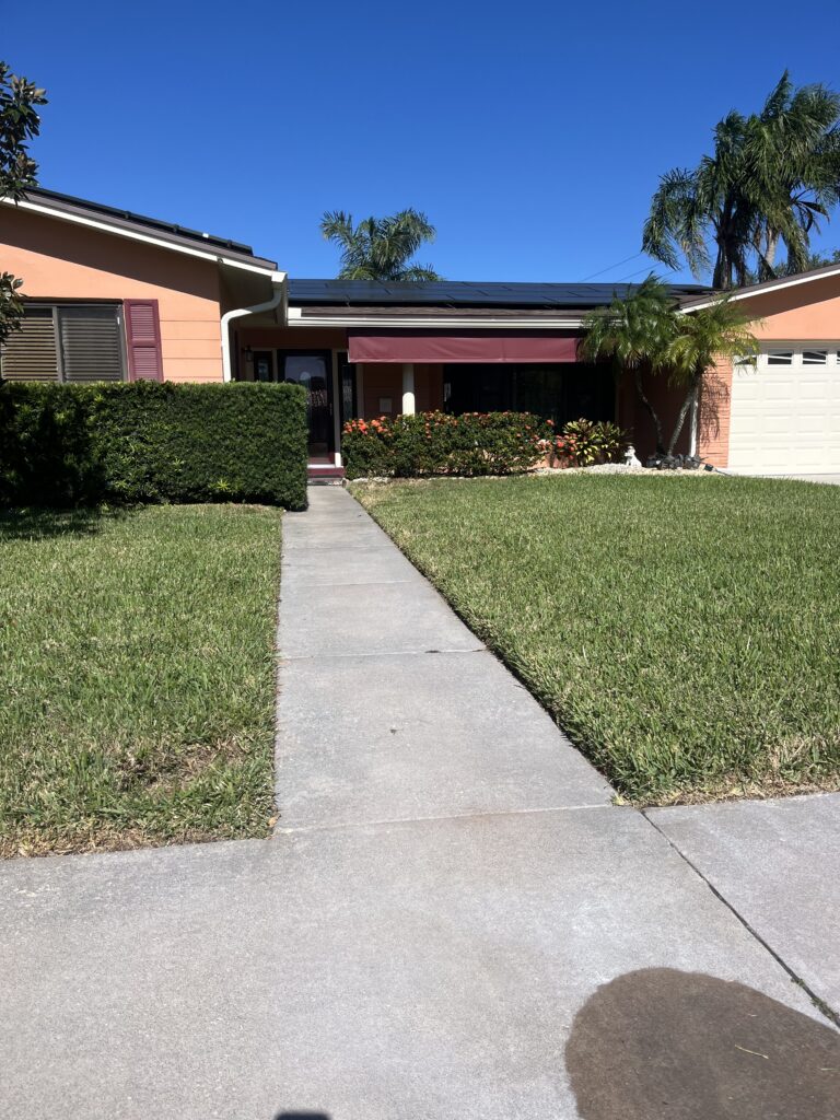 Concrete walkway after professional sprinkler rust stain removal