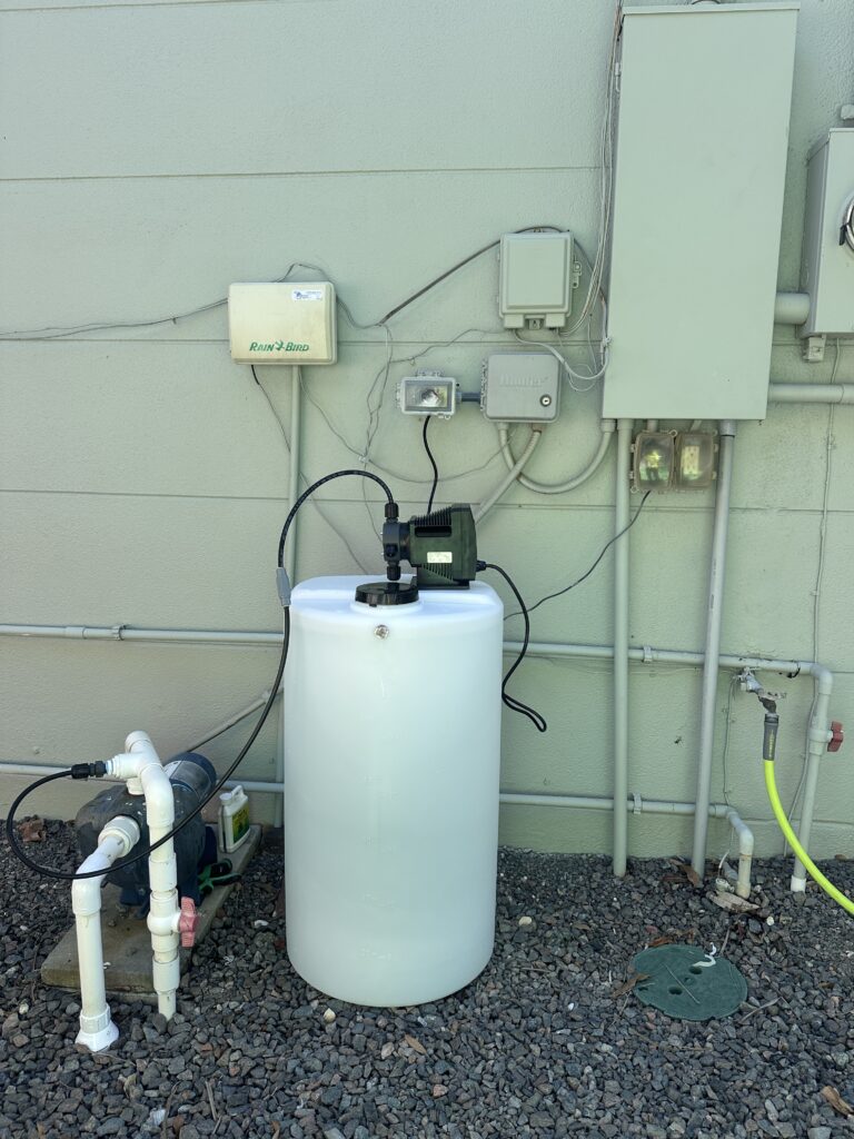 Irrigation rust prevention chemical injection system installed beside a Florida home