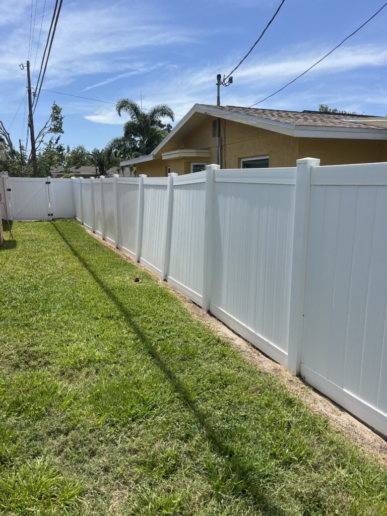White vinyl fence after professional irrigation rust stain removal